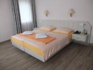 Letto o letti in una camera di Hotel Garni Classico
