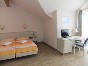 Postel nebo postele na pokoji v ubytování Hotel Garni Classico + 25 fotografií