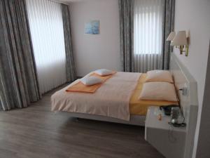 Letto o letti in una camera di Hotel Garni Classico