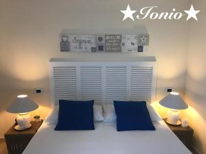 Voodi või voodid majutusasutuse La Terra dei Mari Room & Relax toas