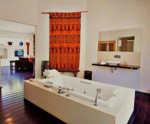 a bathroom with a large bath tub in a room at Blue Cliffs Retreat in Hepburn Springs