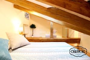 Łóżko lub łóżka w pokoju w obiekcie Plaza Mayor - Exclusivo Apartamento Dúplex