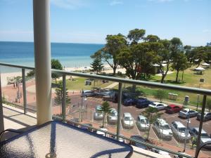 a balcony with a view of a parking lot at Boardwalk By The Beach in Rockingham