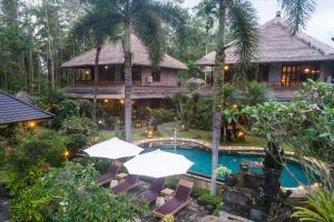 an aerial view of a resort with a swimming pool at Hotel Bunga Permai in Ubud