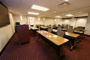 a classroom with tables and chairs in a room at Hyatt Place Flushing/LGA Airport in Queens