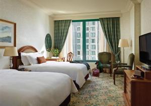 Postel nebo postele na pokoji v ubytování The Langham Melbourne