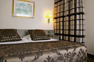 Postel nebo postele na pokoji v ubytování Hotel Iris