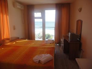 Postel nebo postele na pokoji v ubytování Barex Family Hotel + 37 fotografií