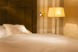 Postel nebo postele na pokoji v ubytování Boutique-Hotel Moseltor