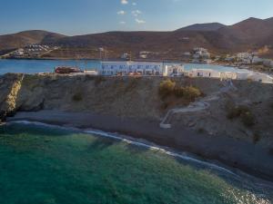 an aerial view of a beach with buildings and the water at Vardia Bay Studios in Karavostasi