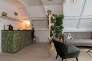 a living room with a couch and a table at Way Up Studio in Amsterdam
