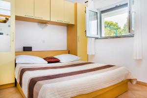 Postel nebo postele na pokoji v ubytování Apartments Zovko