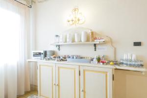 Kuchyň nebo kuchyňský kout v ubytování Hotel Moderno