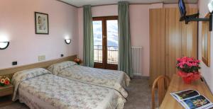 Postel nebo postele na pokoji v ubytování Hotel Les Saisons