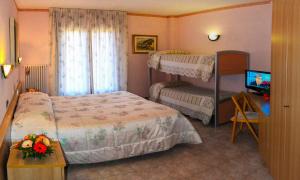 Postel nebo postele na pokoji v ubytování Hotel Les Saisons