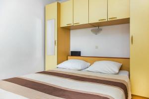 Postel nebo postele na pokoji v ubytování Apartments Zovko