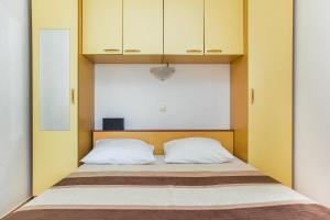 Postel nebo postele na pokoji v ubytování Apartments Zovko