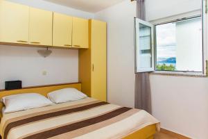 Postel nebo postele na pokoji v ubytování Apartments Zovko