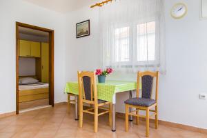 Postel nebo postele na pokoji v ubytování Apartments Zovko