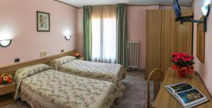 Postel nebo postele na pokoji v ubytování Hotel Les Saisons