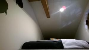 a room with a bed and a light on the wall at Casa MiA in Linardići +29 photos