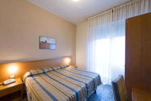 Postel nebo postele na pokoji v ubytování Hotel Moderno