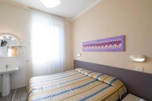 Postel nebo postele na pokoji v ubytování Hotel Moderno
