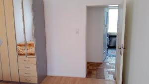 a hallway with a door leading to a bedroom at Monteurwohnungen Santos Lerch in Krefeld +35 photos