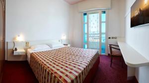 Postel nebo postele na pokoji v ubytování Ruhl Beach Hotel & Suites + 37 fotografií