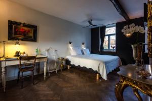Ένα ή περισσότερα κρεβάτια σε δωμάτιο στο Boutique Hotel Bonjour