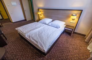 Rúm í herbergi á Hotel Lomsia