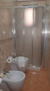 a bathroom with a shower with a toilet and a sink at Bed&Breakfast La Cornucopia in Gallipoli