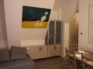 a living room with a couch and a dining room at Apartments Mitic in Kopaonik