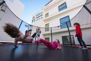 a group of girls playing on a trampoline at Hotel del Juguete in Ibi