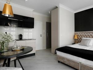 Posteľ alebo postele v izbe v ubytovaní Lavoo Boutique Apartments