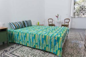 Postel nebo postele na pokoji v ubytování B&B Domus Aurea