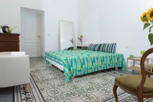 Postel nebo postele na pokoji v ubytování B&B Domus Aurea