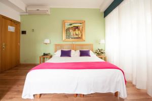 Postel nebo postele na pokoji v ubytování Hotel Touring