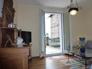 a living room with a sliding glass door at Casa Re in Gravedona