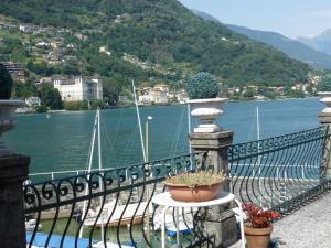 a balcony with a view of a body of water at Casa Re in Gravedona