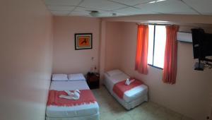 Postel nebo postele na pokoji v ubytování Hostal La Posada De Jose Carlos