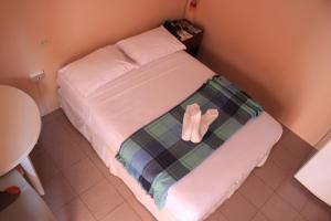 Postel nebo postele na pokoji v ubytování Hostal La Posada De Jose Carlos