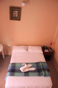 Postel nebo postele na pokoji v ubytování Hostal La Posada De Jose Carlos