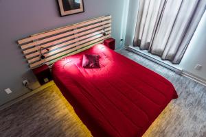 Ένα ή περισσότερα κρεβάτια σε δωμάτιο στο Les appartements HOMA