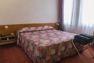 Letto o letti in una camera di Hotel Pico