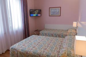 Letto o letti in una camera di Hotel Pico