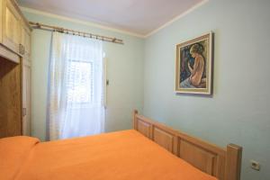 Posteľ alebo postele v izbe v ubytovaní Apartman juričić