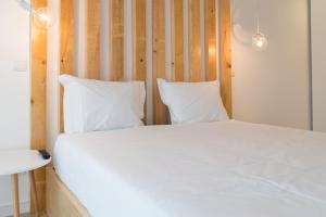 Uma cama ou camas num quarto em Bracara Guest House "D. Pedro V"