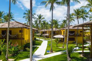 a view of the resort buildings and palm trees at Villa dos Corais in Morro de São Paulo