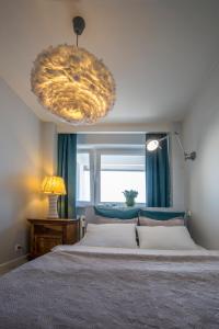 Posteľ alebo postele v izbe v ubytovaní Apartament Świętokrzyska